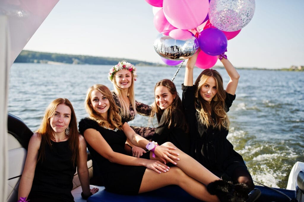 How to Make Your Bachelorette Party Unforgettable 1 Girls having fun at yacht on bachelorette party.